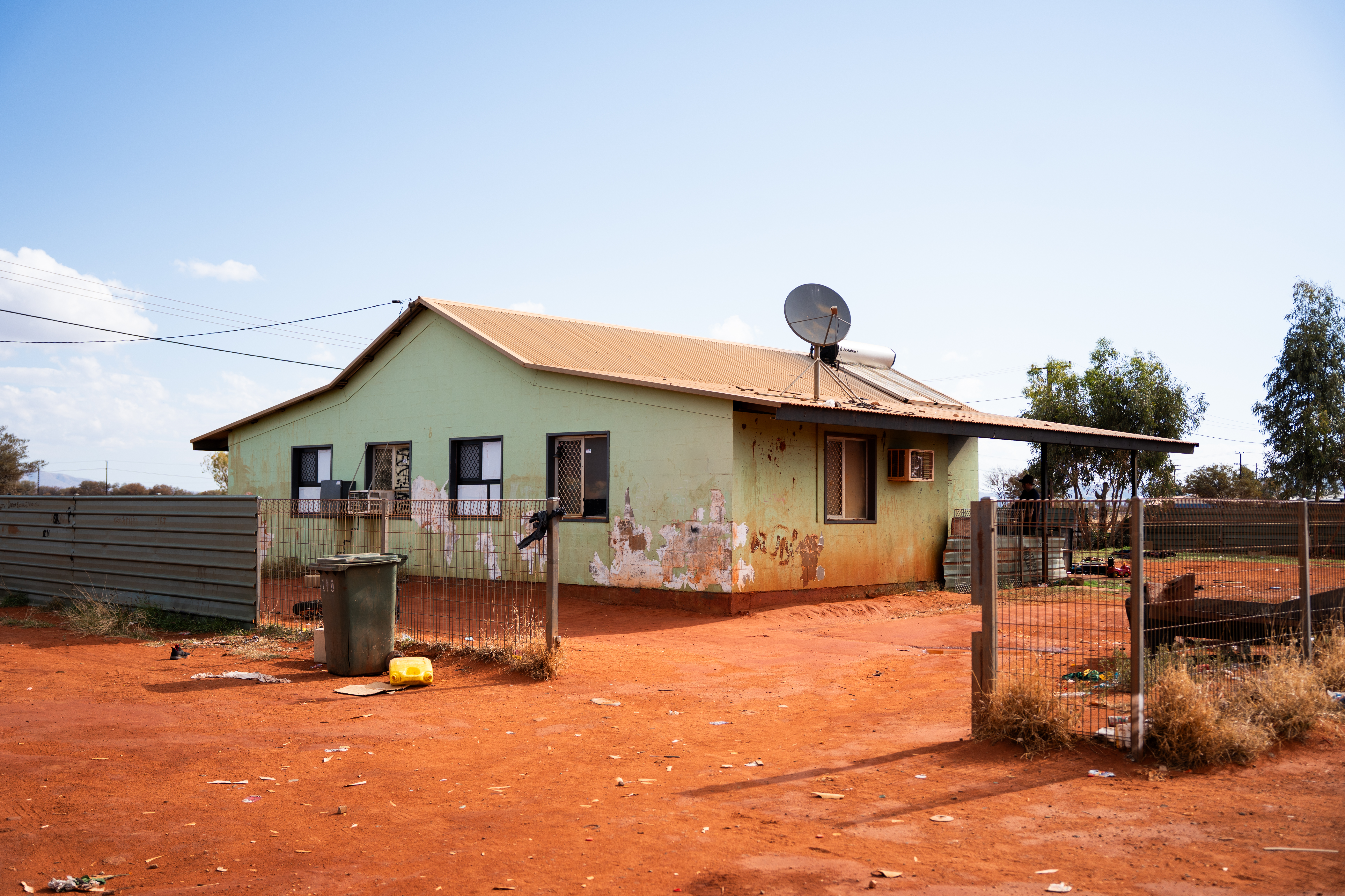 Landmark legal challenge: Remote community sue NT government over ‘unsafe’ housing episode artwork